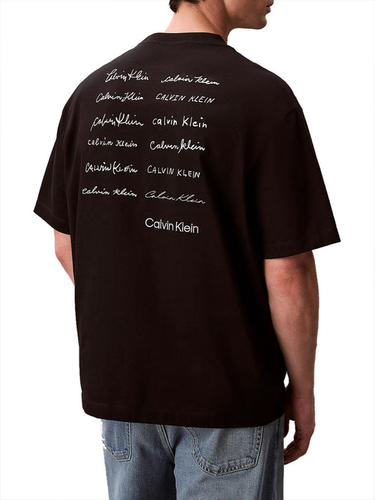 CALVIN2 2USCITA T-Shirt Calvin Klein 16S April Graphic Relaxed - Nero BLACK